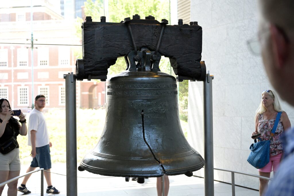 People visit the Liberty Bell on the eve of Independence Day in Philadelphia, Pennsylvania