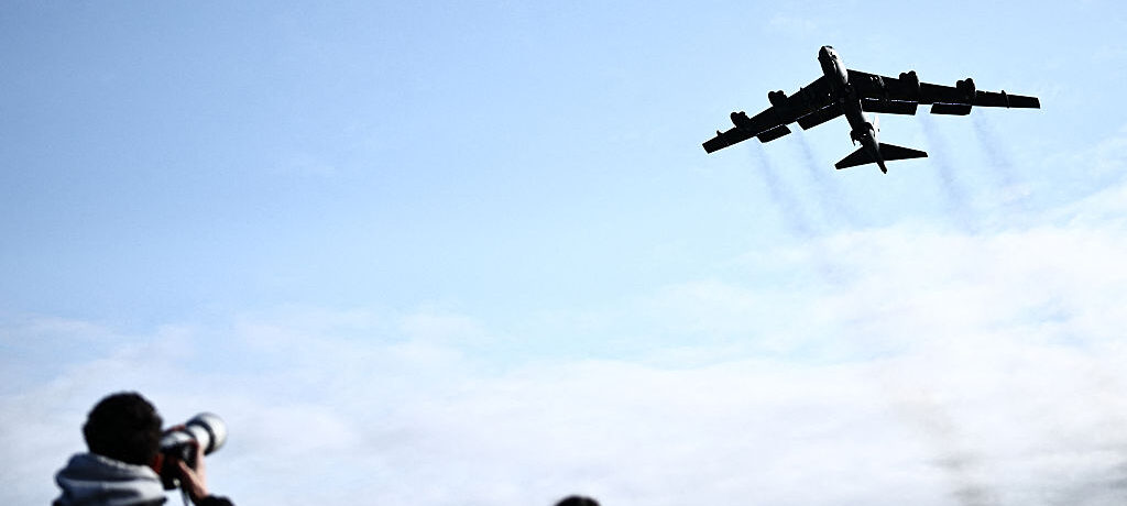 Plane spotters watch a US Air Force B-52 Stratofortress bomber taking off from RAF Fairford in south-west England on March 15, 2026. Fairford is one of two bases, along with the Diego Garcia facility in the Indian Ocean, that the UK has given the US permi