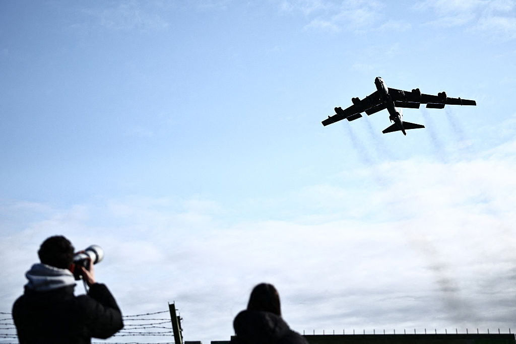 Plane spotters watch a US Air Force B-52 Stratofortress bomber taking off from RAF Fairford in south-west England on March 15, 2026. Fairford is one of two bases, along with the Diego Garcia facility in the Indian Ocean, that the UK has given the US permi