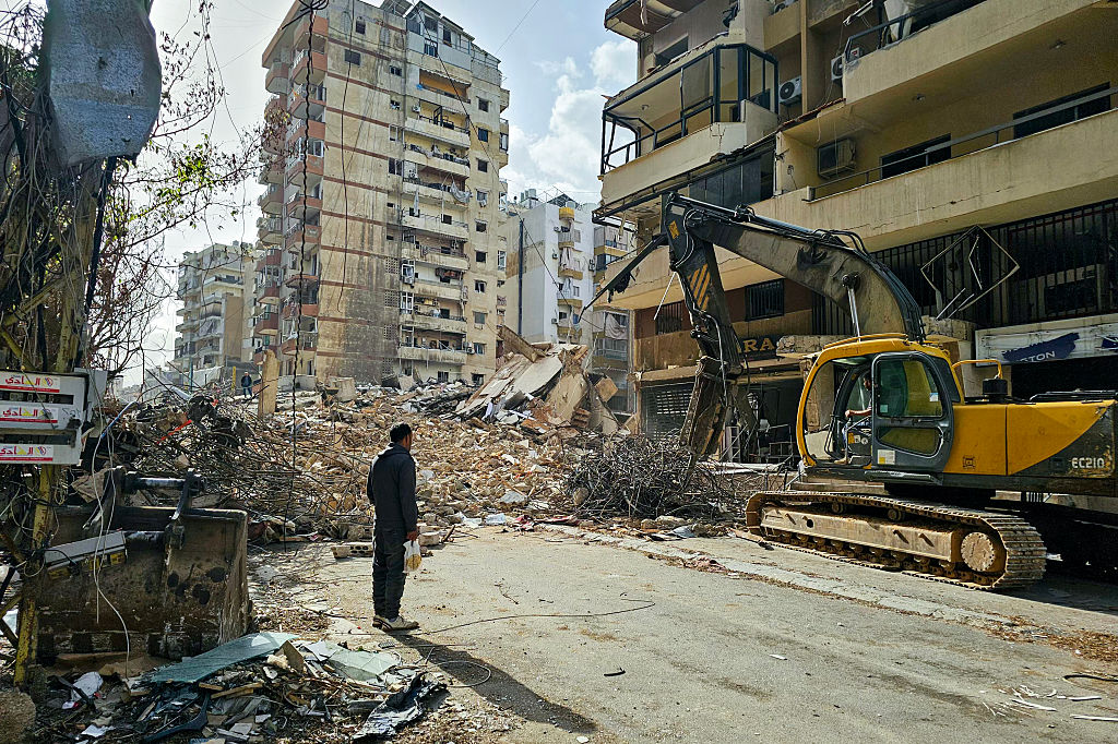 A bulldozer clears the rubble from the site of an Israeli airstrike as people return to Beirut's southern suburbs on April 19, 2026. On April 17 a ceasefire between Israel and Lebanon took effect.