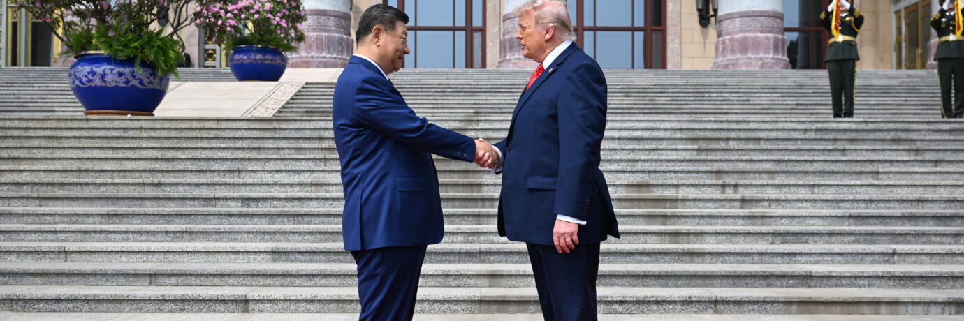 .S. President Donald Trump (R) is greeted by Chinese President Xi Jinping at the Great Hall of the People on May 14, 2026 in Beijing, China.