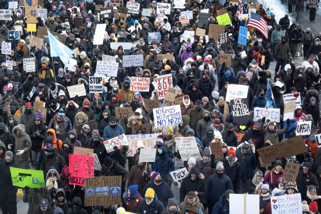 Demonstrators march through downtown protesting ICE operations and the death of Renee Good and Alex Pretti on January 25, 2026 in Minneapolis, Minnesota.