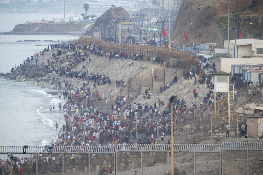 Dozens of migrants are attempting to cross the border between Ceuta and Morocco, on 31 July, 2026 in Ceuta, Spain. Large numbers of people continued to enter Ceuta from Morocco in an uncontrolled manner as night fell on July 30, 2026.