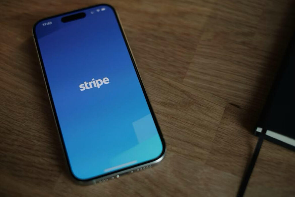Stripe app loading screen on a smartphone, the payment processor central to the financial deplatforming of conservatives.